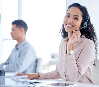 shot-of-a-young-call-centre-agent-sitting-with-her-2025-04-06-10-43-48-utc-scaled.jpg